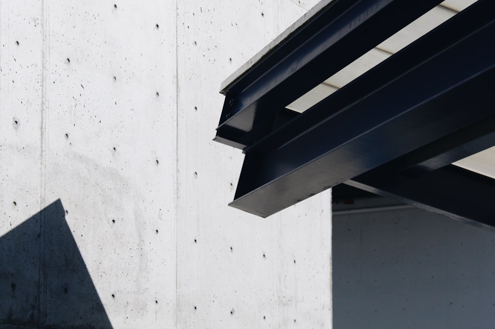 a close up of a metal beam on a building