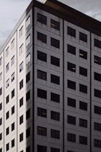 Modern office building exterior with subtle gray tones reflecting Murathan Group's professionalism.