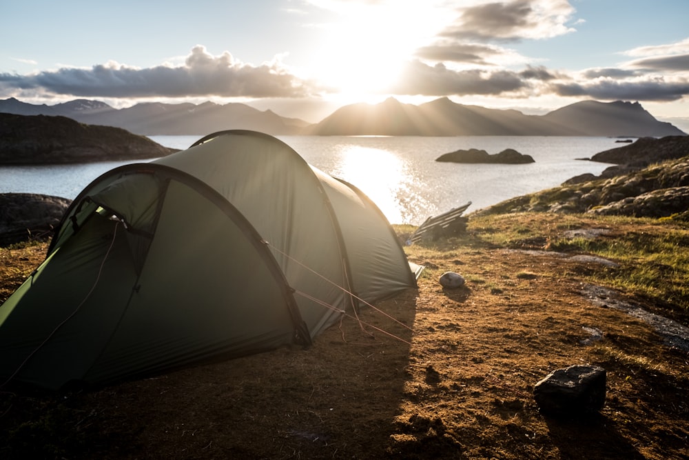 gray tent on top of mountain