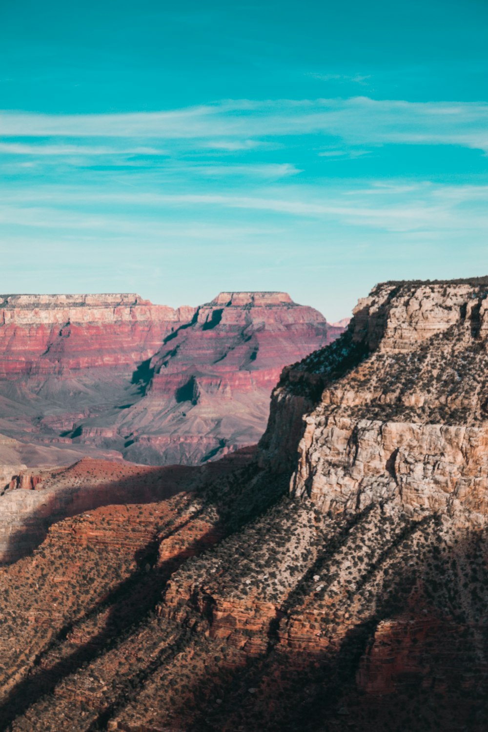 brown rocky mountain under blue sky during daytime