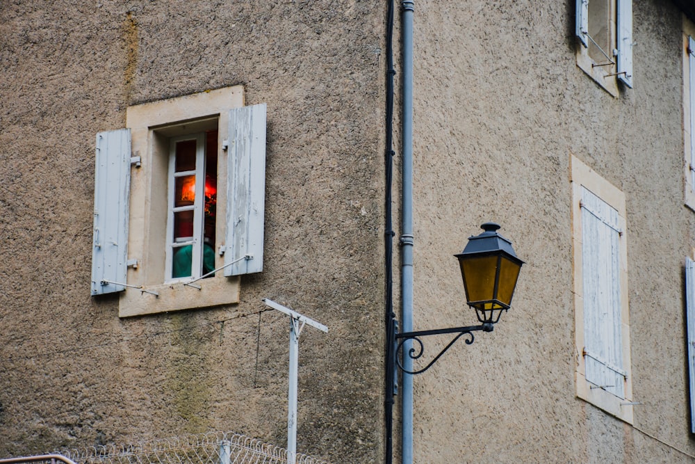 black sconce lantern at daytime