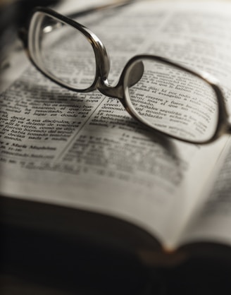 tilt-shift photography of eyeglasses with silver-colored frames