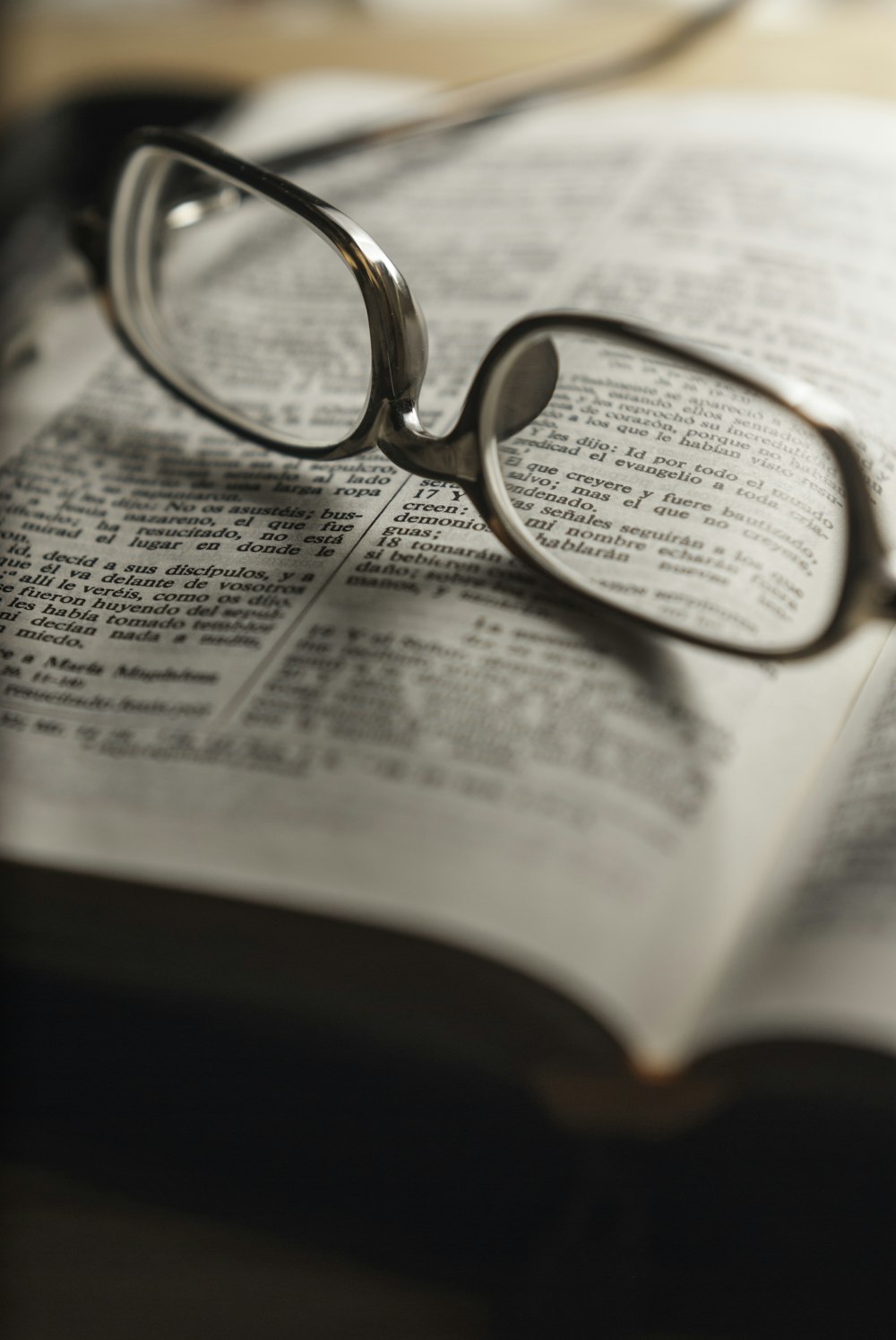 tilt-shift photography of eyeglasses with silver-colored frames