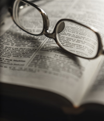 tilt-shift photography of eyeglasses with silver-colored frames