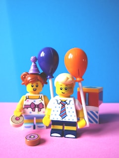 girl and boy holding balloon Lego minifugures
