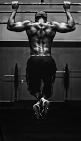 grayscale photo of man working out