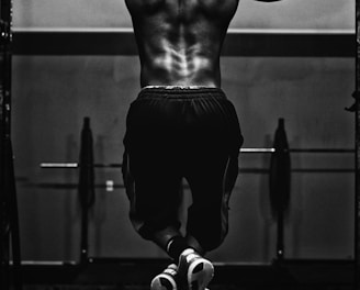 grayscale photo of man working out