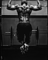 grayscale photo of man working out