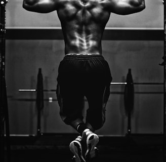 grayscale photo of man working out