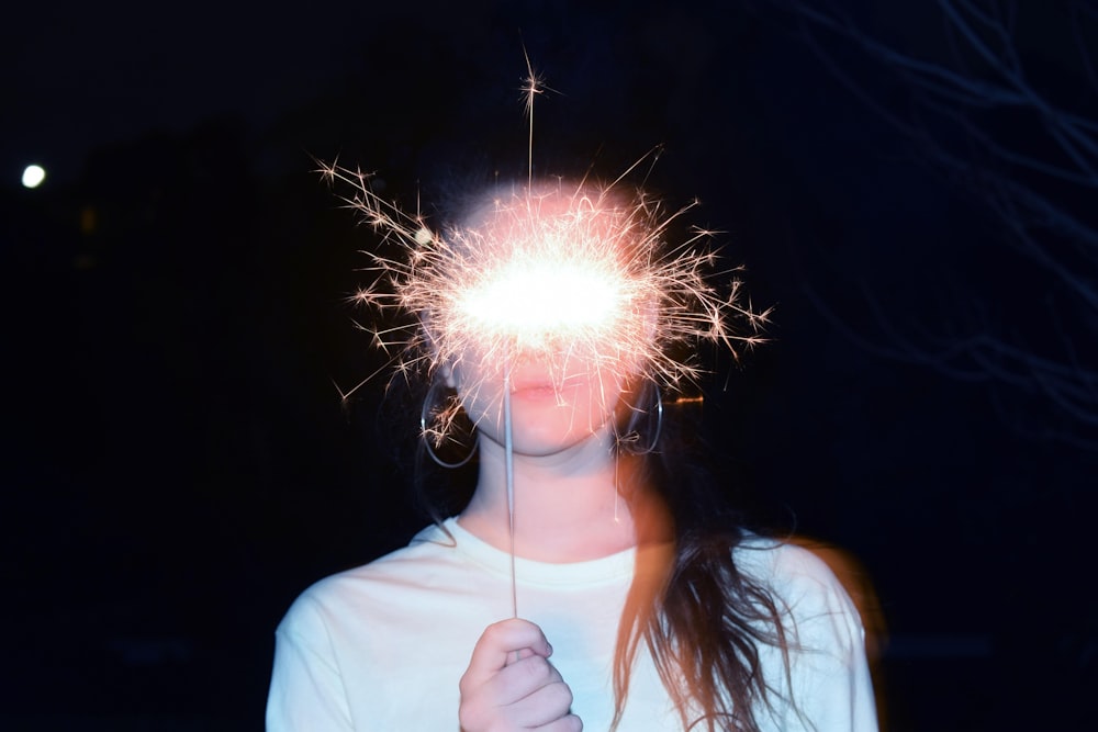 woman holding firecracker