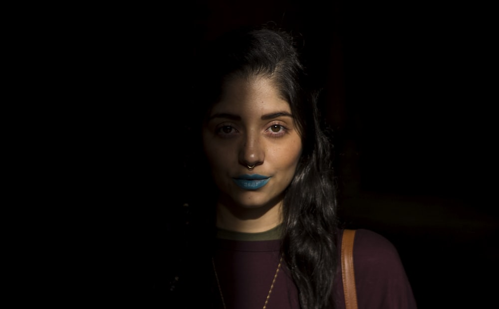 woman wearing blue lipstick