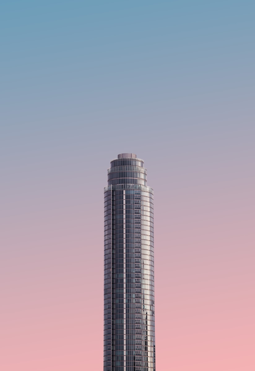 St George Wharf Tower, a residential high-rise in Nine Elms, London, framed against a pink-to-blue sunset sky