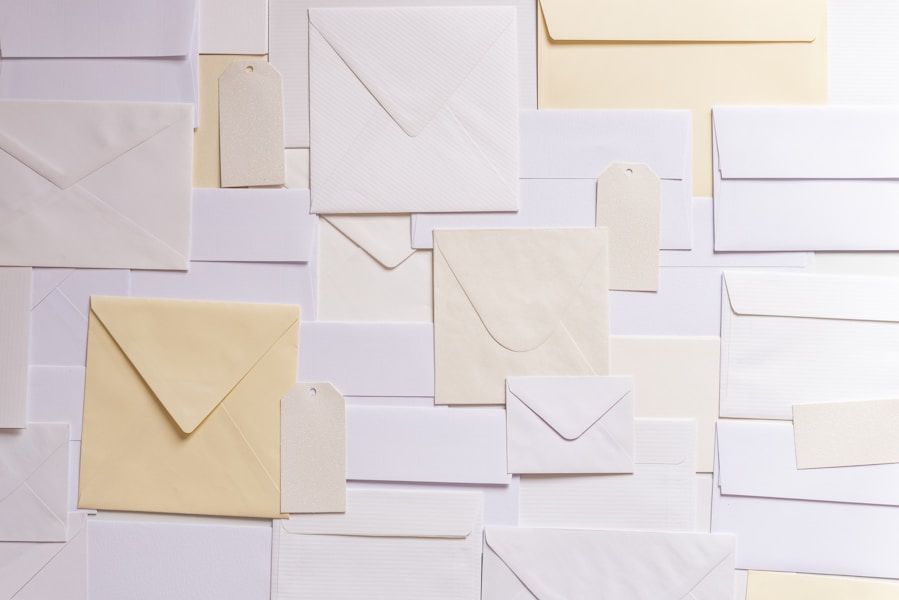 Overlapping white and cream envelopes spread across a flat surface