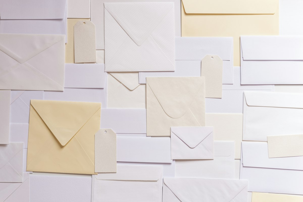 Arranged white and off-white envelopes