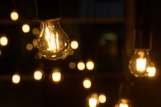 Warm glowing LED bulbs hanging in a cozy room setting