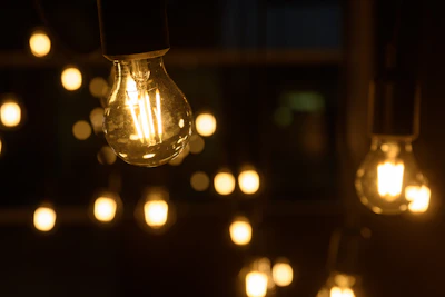 Warm glowing LED bulbs hanging in a cozy room setting