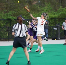 women playing lacrosse