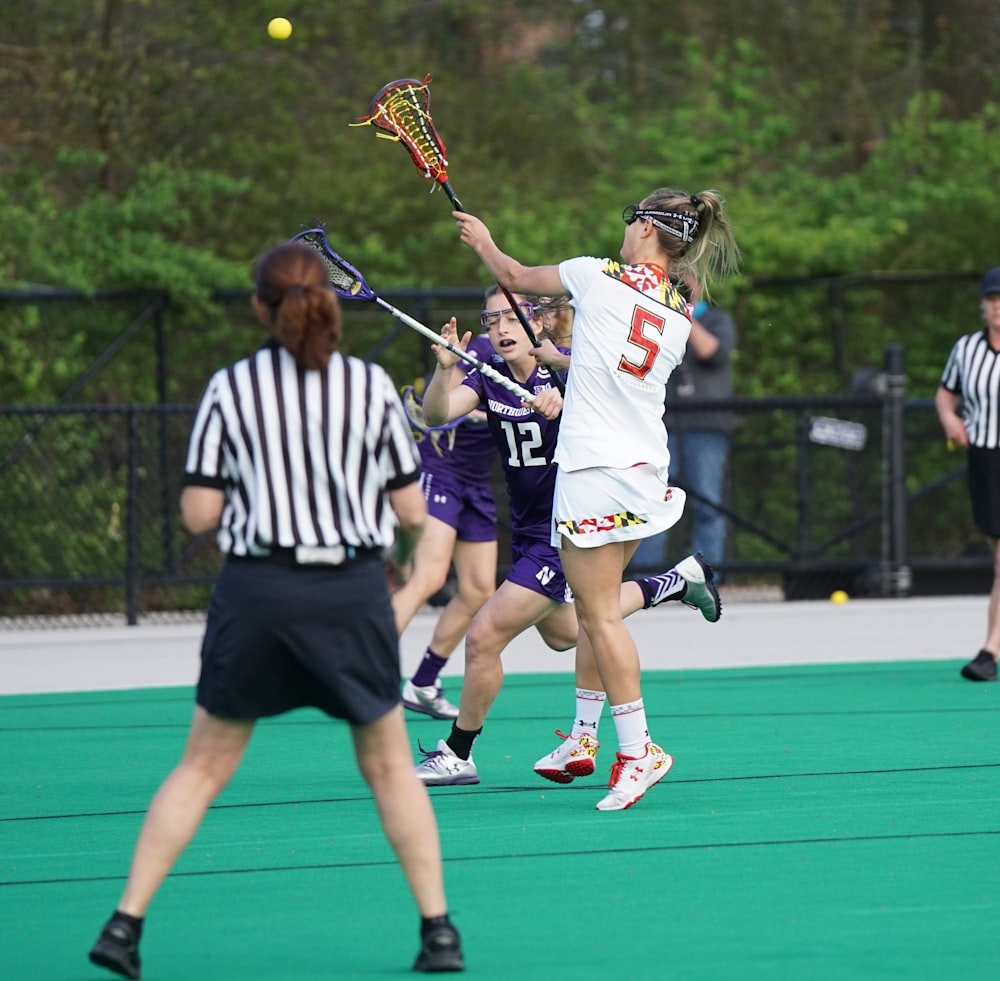 women playing lacrosse