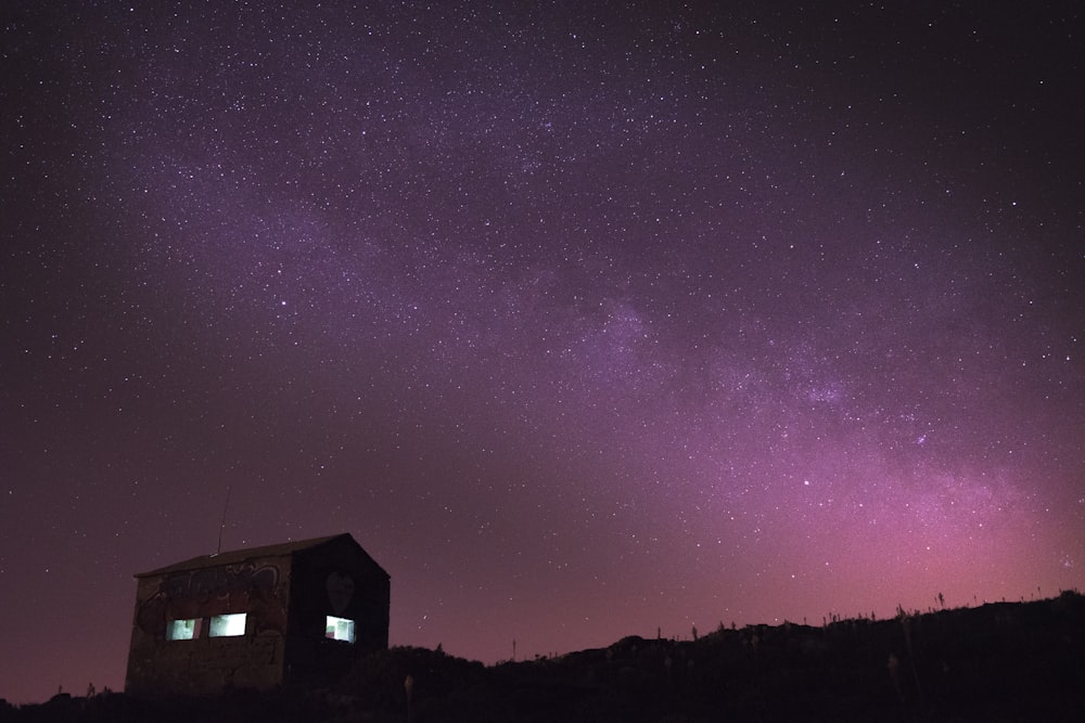 silhouette of house during night time