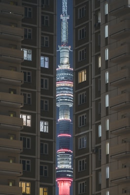 Night view of a commercial tower illuminated with artistic lighting.
