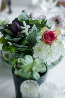 A modern flower case displayed amid lush greenery, highlighting its durable yet delicate design.