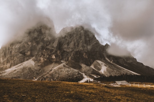 brown rocky mountain covering with fogs in Peitlerkofel Italy