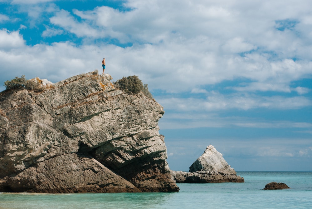 man standing on cliff