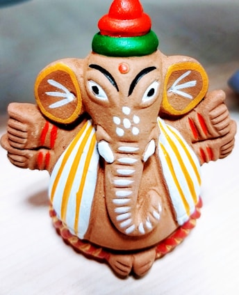 Close-up of a colorful rubber elephant figurine with intricate details