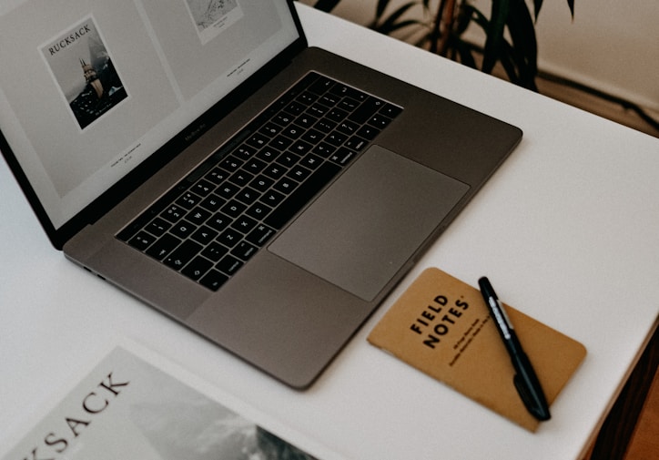 MacBook Pro on white table