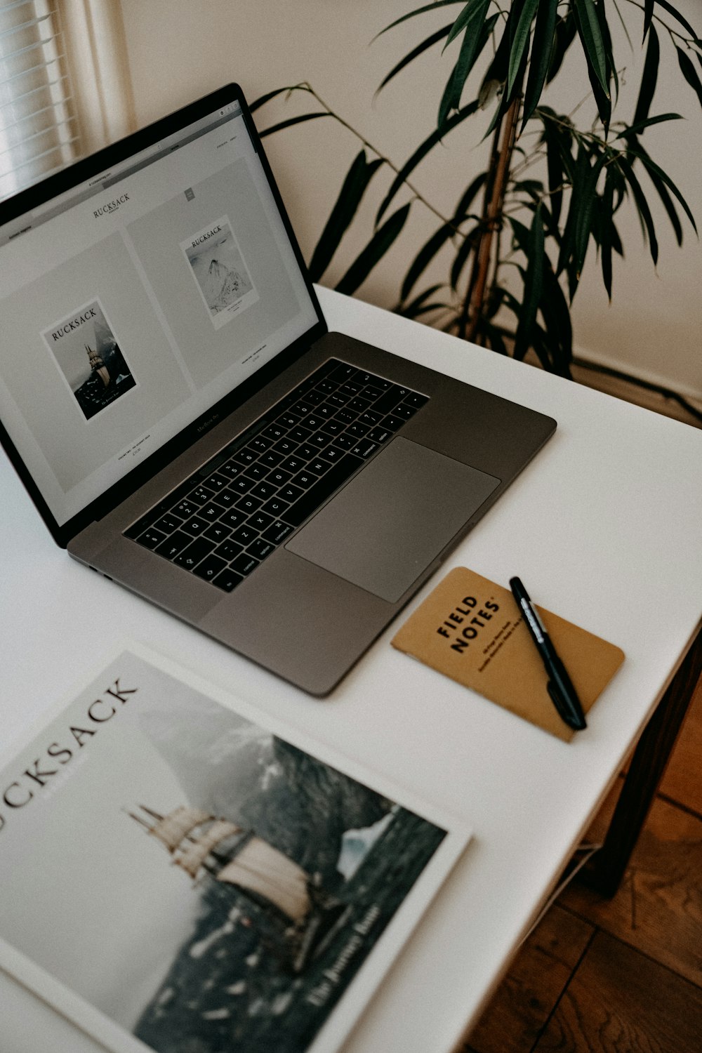 MacBook Pro on white table