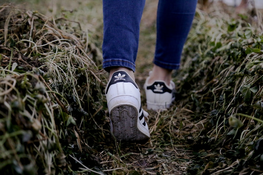 person walking on grass