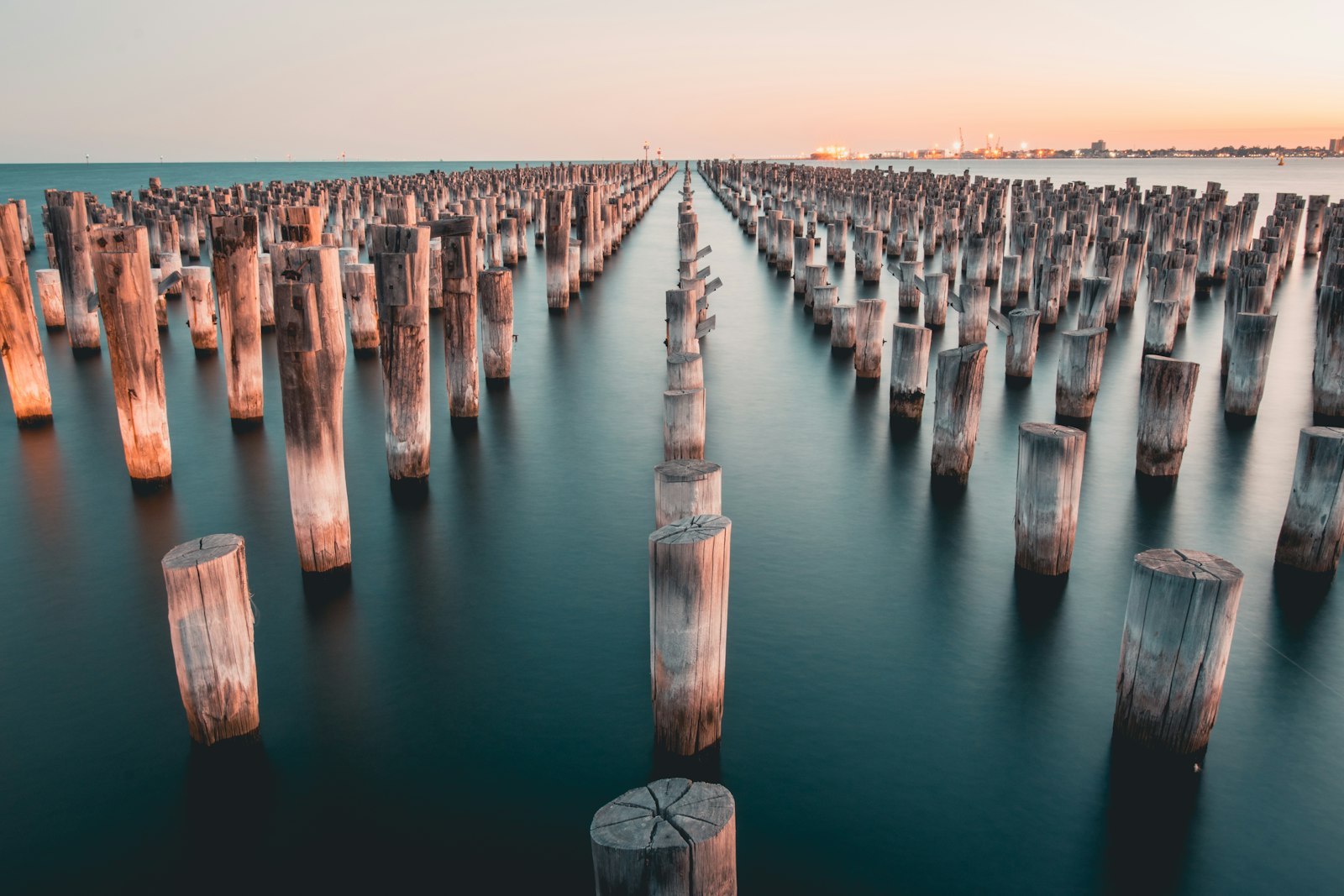 Nikon D5300 + Sigma 18-35mm F1.8 DC HSM Art sample photo. Wood logs towered in photography