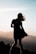 silhouette of woman on hill top view