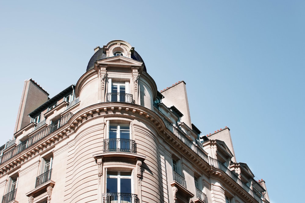 low angle photography of white and beige concrete building