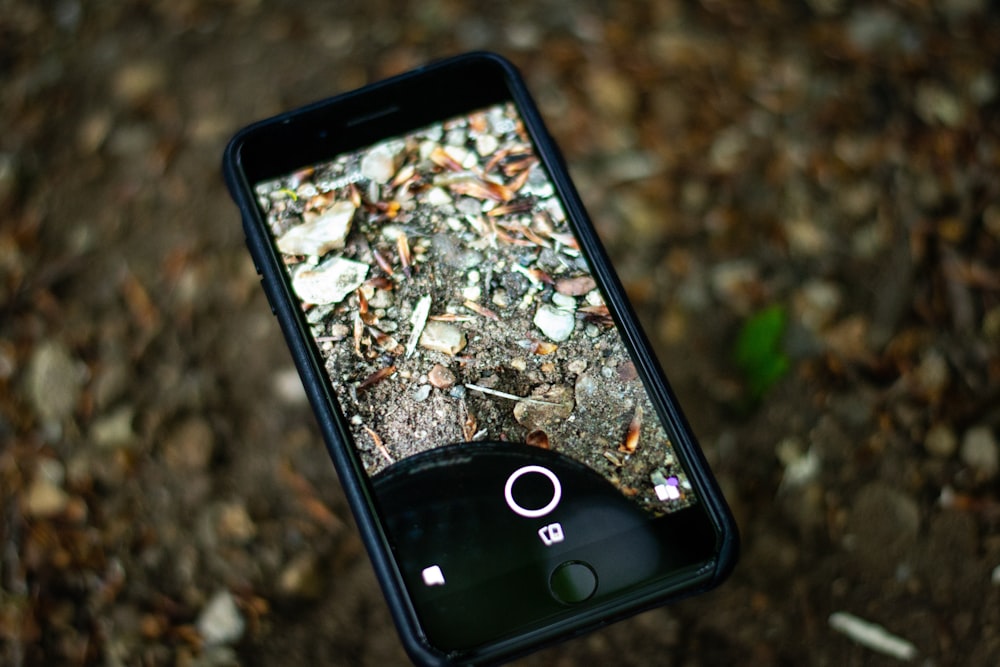 iPhone displaying camera with image of rocks