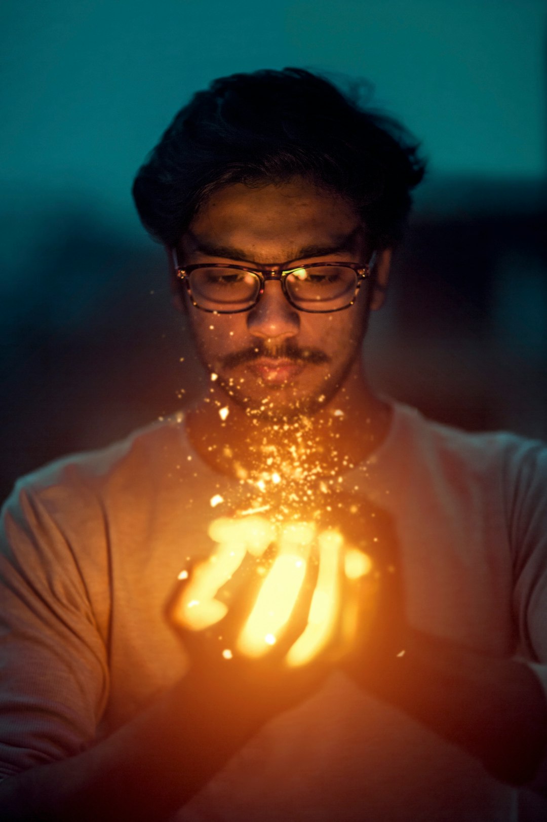 man holding lighted art