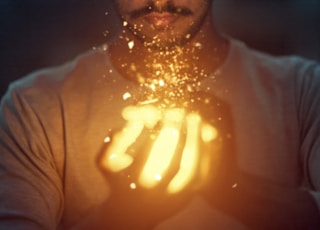 man holding lighted art