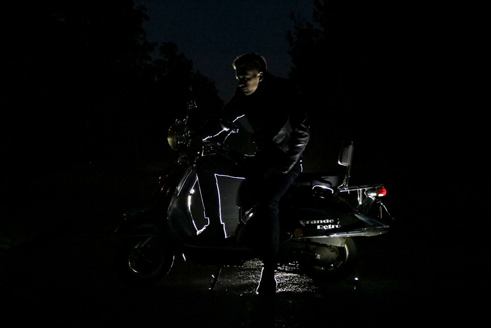 man sitting on motorcycle