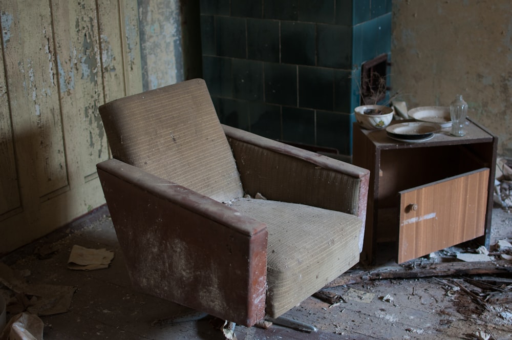 brown fabric armchair beside side table