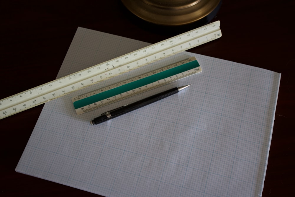 white ruler on paper