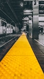 selective color photo of train station
