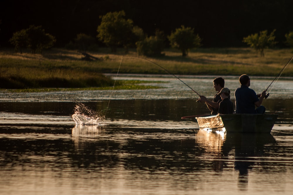 man in blue shirt riding on boat during daytime