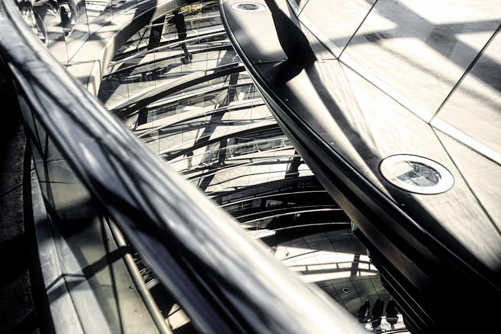 a group of people riding on top of an escalator