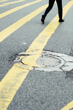 person walking on road