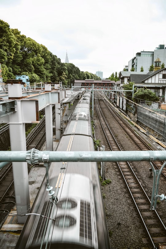 gray metal train rail during daytime in Takeshita Street Japan