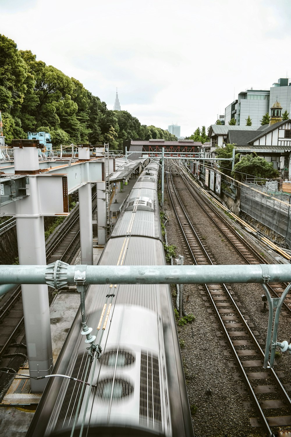 gray metal train rail during daytime