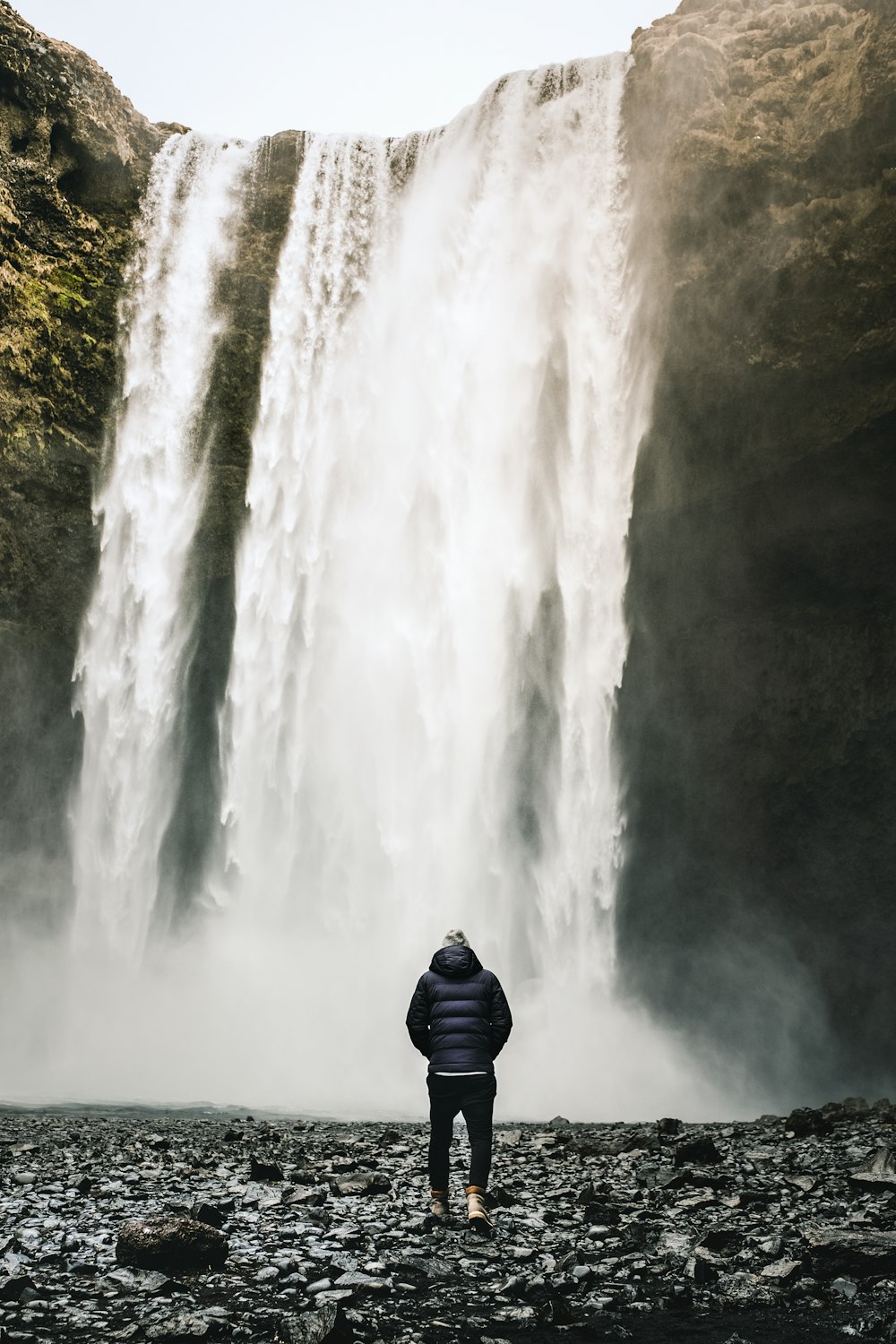person standing near at the falls