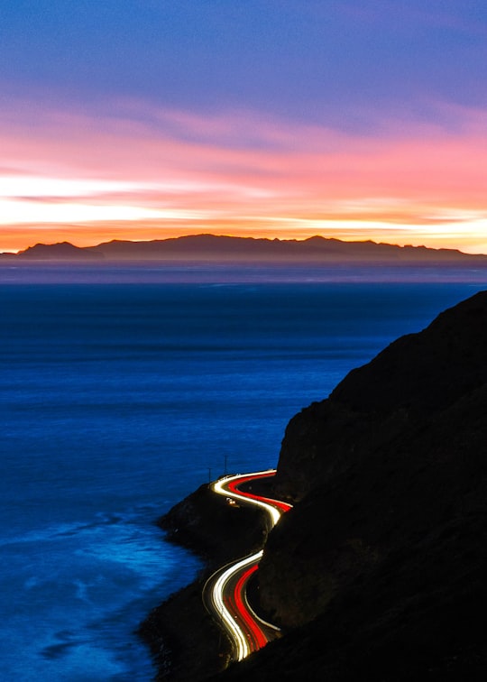time-lapse photography of cliff road during golden hour in Malibu United States