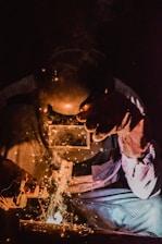 person welding metal