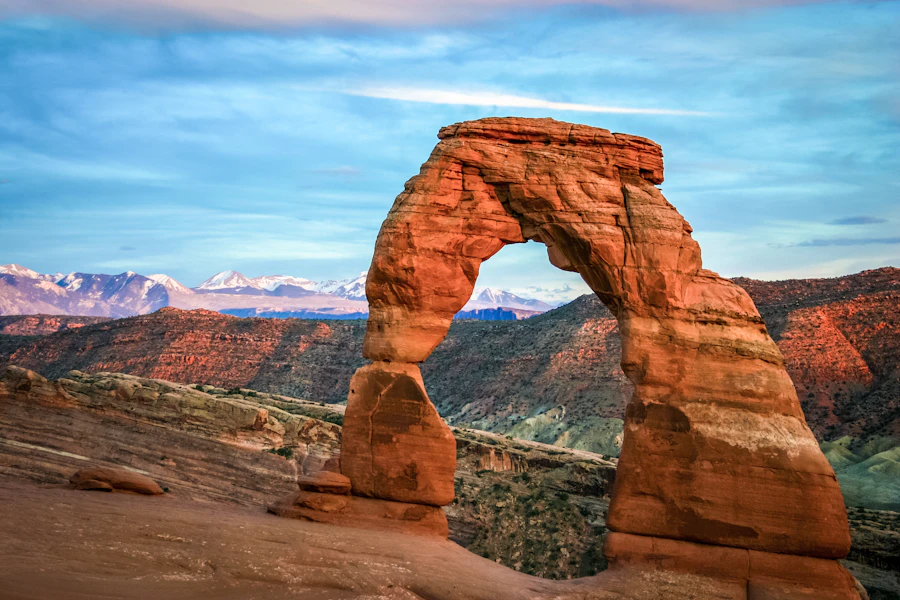 Delicate Arch framed against the snow-capped La Sal Mountains in Arches National Park